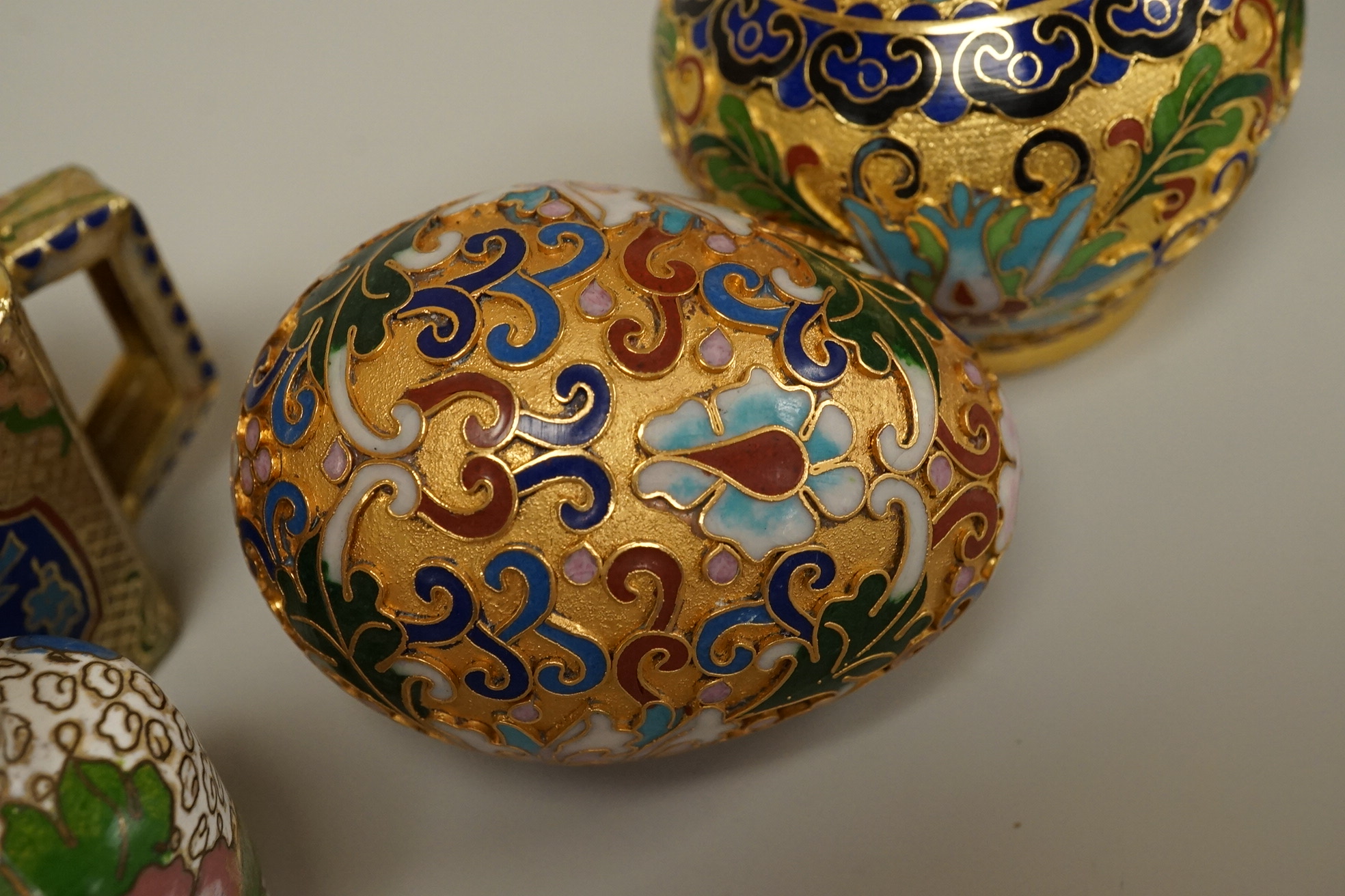 A collection of miniature enamel and cloisonné boxes, eggs and a painted rabbit, etc. (11)